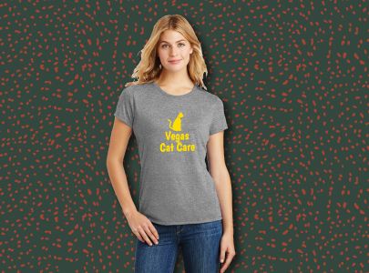 Woman wearing gray, cotton, women’s t-shirt screen printed with Vegas Cat Care logo for Las Vegas, Nevada